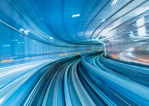 Blurred blue road into tunnel